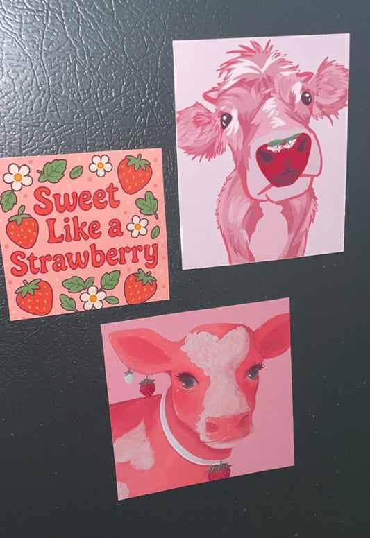 3 Piece Set of Adorable Strawberry Cow Themed Magnets with Sweet Strawberry Accents on Pink Background
